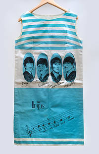 A Signed Beatles dress worn by a programme seller at the world premiere of A Hard Day's Night,...