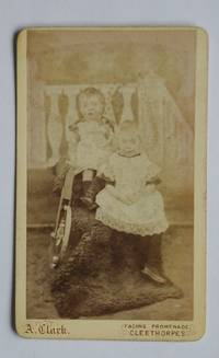 Carte De Visite Photograph: Studio Portrait of Two Young Children with a Toy.