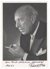 Bust-length photograph of the noted Austrian composer and conductor in formal attire, cigarette in hand, signed, inscribed "Herrn Emil Mösslinger allerherzlichst," and dated September [19]65