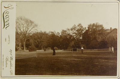Photograph of 4 women playing lawn tennis