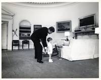 [PHOTOGRAPHS] TWO PRESS PHOTOGRAPHS. KENNEDY IN THE OVAL OFFICE