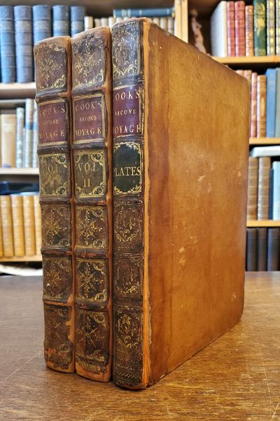 [COOK'S SECOND VOYAGE]. A Voyage Towards the South Pole, and Round the World. Performed in His Majesty’s Ships the Resolution and Adventure, in the Years 1772, 1773, 1774, and 1775. Written by James Cook, Commander of the Resolution. To which is included, Captain Furneaux’s Narrative of his Proceedings in the Adventure during the Separation of the Ships. In Two Volumes. Illustrated with Maps and Charts, and a Variety of Portraits of Persons and Views of Places, drawn during the Voyage by Mr. Hodges, and engraved by most eminent Masters. The Second Edition. [3 volumes; 2 volumes of text, 1 volume of plates].