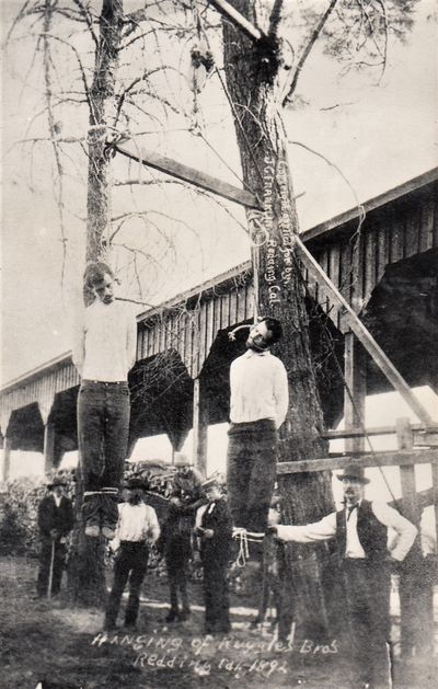 Three photographic postcards: 2 of lynchings (one identified) and a third of gallows
