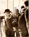 A wartime press photograph of British Prime Minister Winston S. Churchill, accompanied by his close friend and chief scientific advisor Frederick Alexander "Prof" Lindemann, watching an air battle from an observation post near Dover on 28 August 1940 during the Battle of Britain