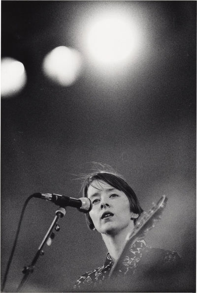 N.p.: N.p., 1989. Vintage borderless photograph of singer Suzanne Vega performing at Gröna Lund in ...