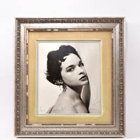 Fine head and shoulders black and white photographic portrait of Gloria Vanderbilt as a young woman, inscribed in the margin “For Isabel [Leighton] with love Gloria”