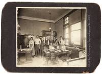 Interior of the Burlington Railroad Telegraph Office at Casper, Wyoming. With Seven Office Workers