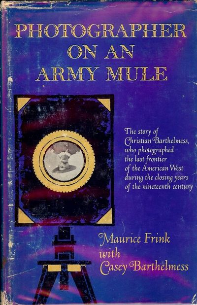 PHOTOGRAPHER ON AN ARMY MULE