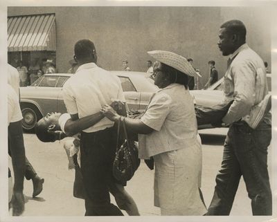 Press Photo of an Injured Black Man...