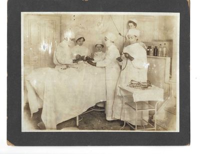 Woman Surgeon and Medical Team Perform Operation circa 1920