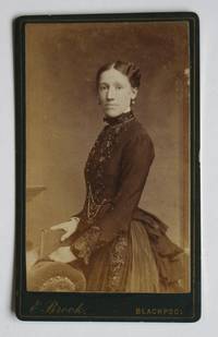 Carte De Visite Photograph. Portrait of a Young Lady Holding a Book. by E. Brook