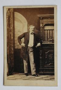 image of Carte De Visite Photograph. A Studio Portrait of an Unknown Gentleman Beside a Bookcase Cabinet.