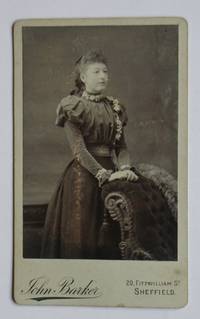 image of Carte De Visite Photograph: Portrait of a Finely Dressed Young Woman.