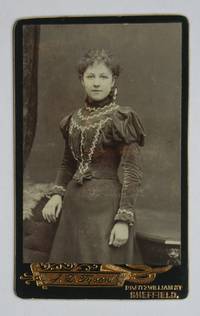 image of Carte De Visite Photograph: Portrait of a Finely Dressed Young Woman.