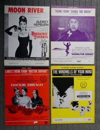 MOON RIVER / THEME FROM &quot;ZORBA THE GREEK&quot; / LARA&#039;S THEME FROM &quot;DOCTOR ZHIVAGO&quot; / THE WINDMILLS OF YOUR MIND: THEME FROM &quot;THE THOMAS CROWNE AFFAIR&quot;.  SHEET MUSIC FROM 1960s MOVIES.  4 ITEMS. de Johnny Mercer (Henry Mancini) / Mikis Theodorakis / Maurice Jarre / Marily and Alan Bergman (Michel LeGrand)